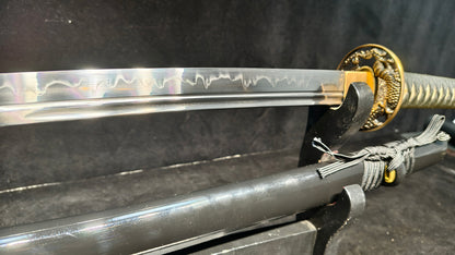 (covered with soil and burned to create the blade's ripple pattern)katana