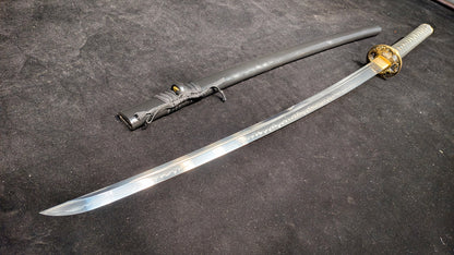 (covered with soil and burned to create the blade's ripple pattern)katana
